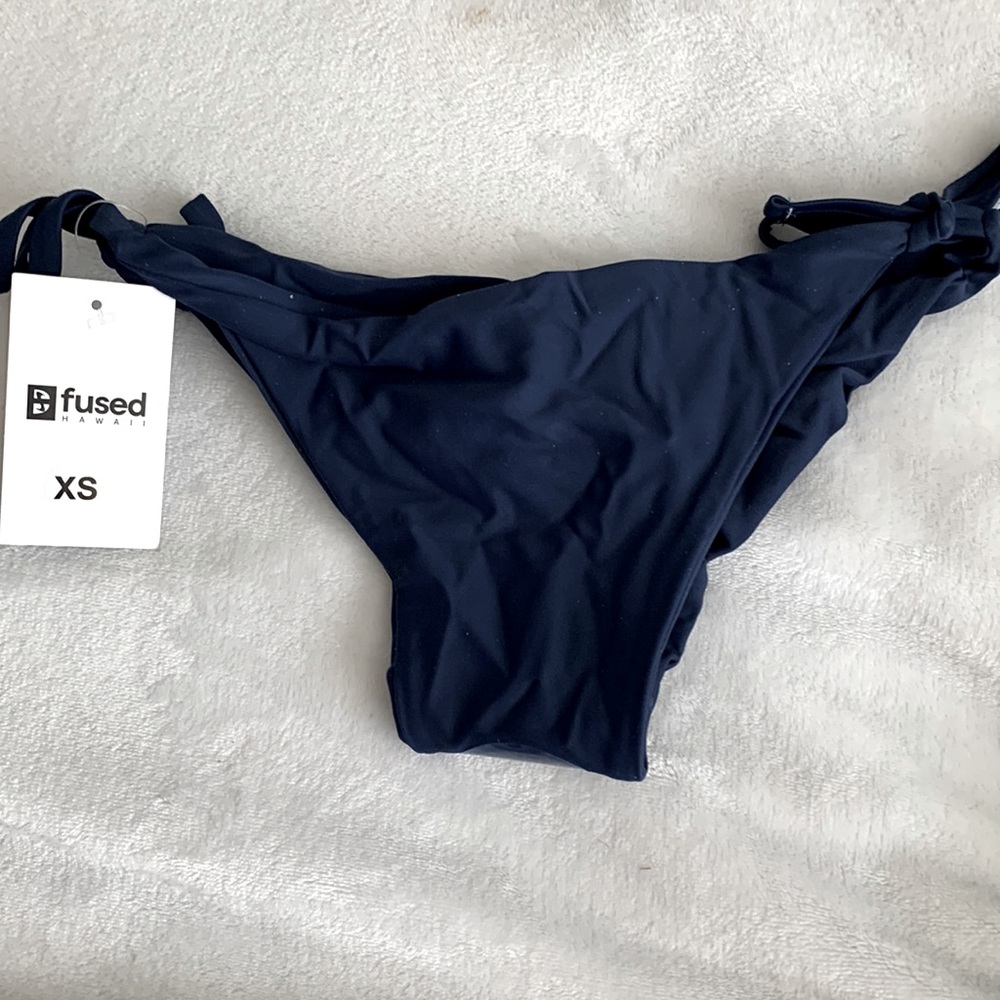 Fused Hawaii aloha style xs navy bikini bottom. New with tags